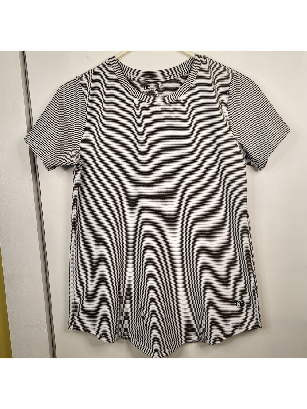 Belong Designs women's albion fitness top features a black and white pinstripe